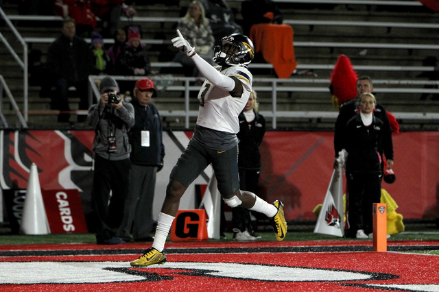 Johnson's 3 TDs lead Toledo past Ball State 58-17